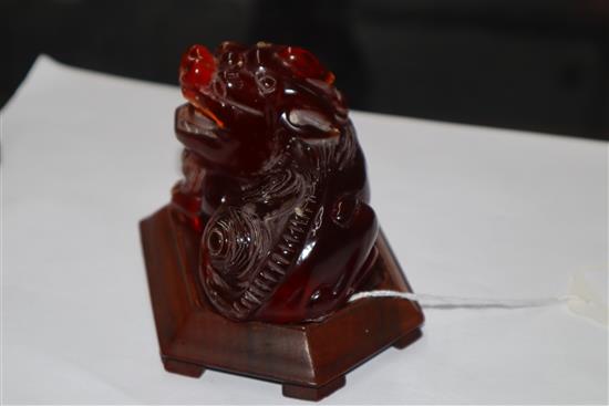 A Japanese ivory cane handle, a faux amber lion-dog and an enamel and ivory pill box